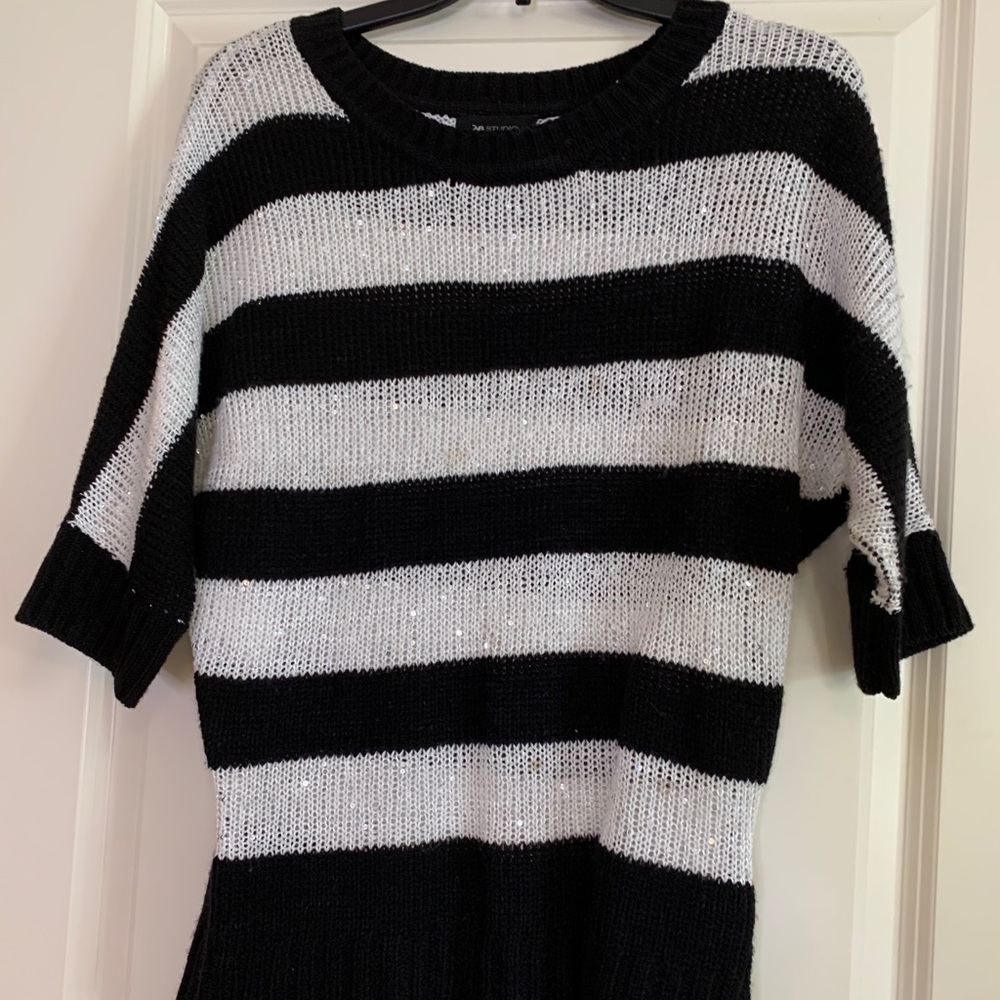 Black and white striped sweater.